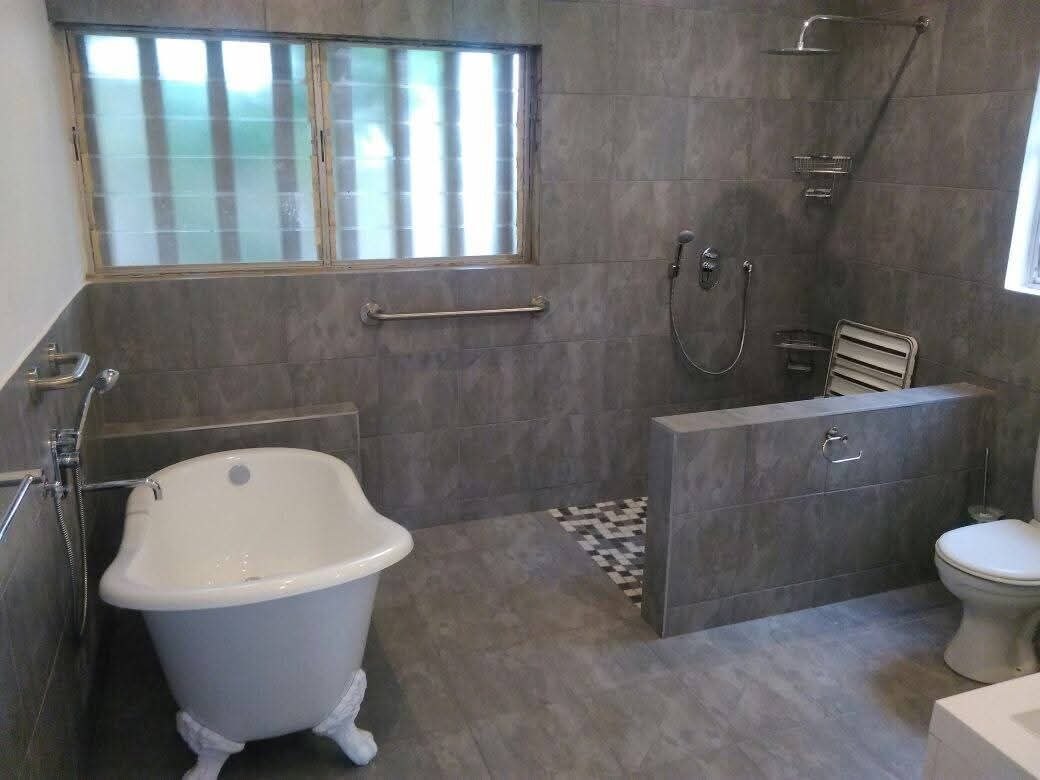 Finished grey bathroom renovation with freestanding bath by ERS Plumbers