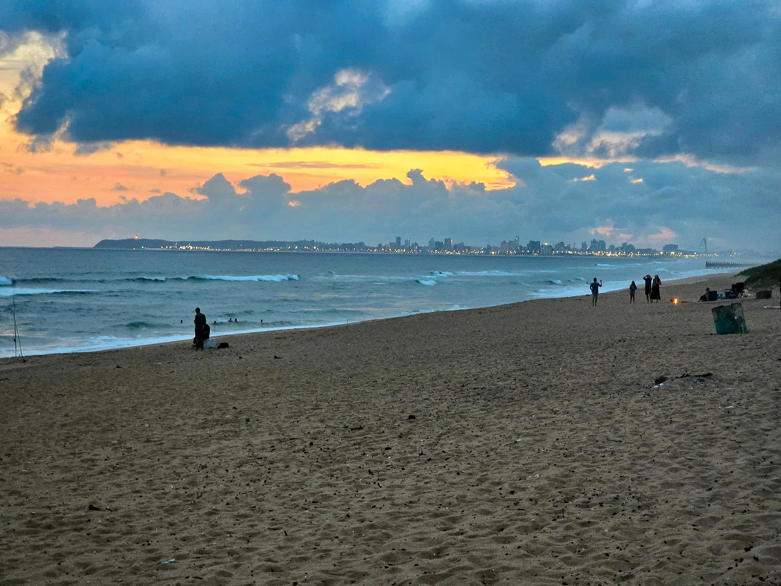 Glenashley beach at sunset with the Durban skyline in the distance