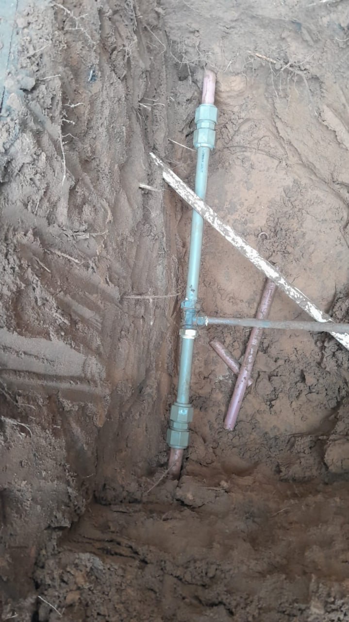 Exposed underground supply pipework before the repair is closed