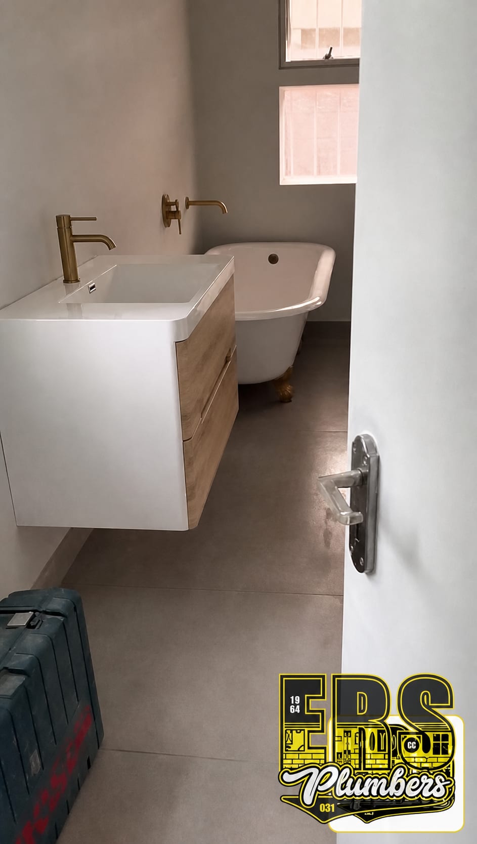Completed ERS bathroom renovation with floating vanity and freestanding bath in Durban North
