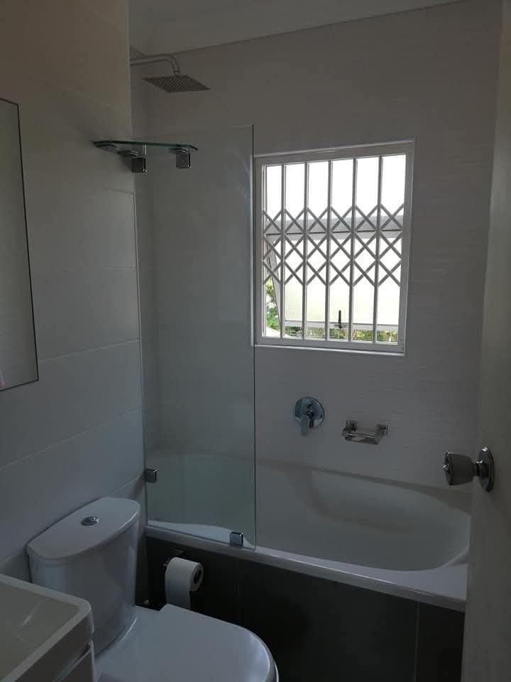 Completed ERS bathroom renovation with bath, shower screen and new fixtures
