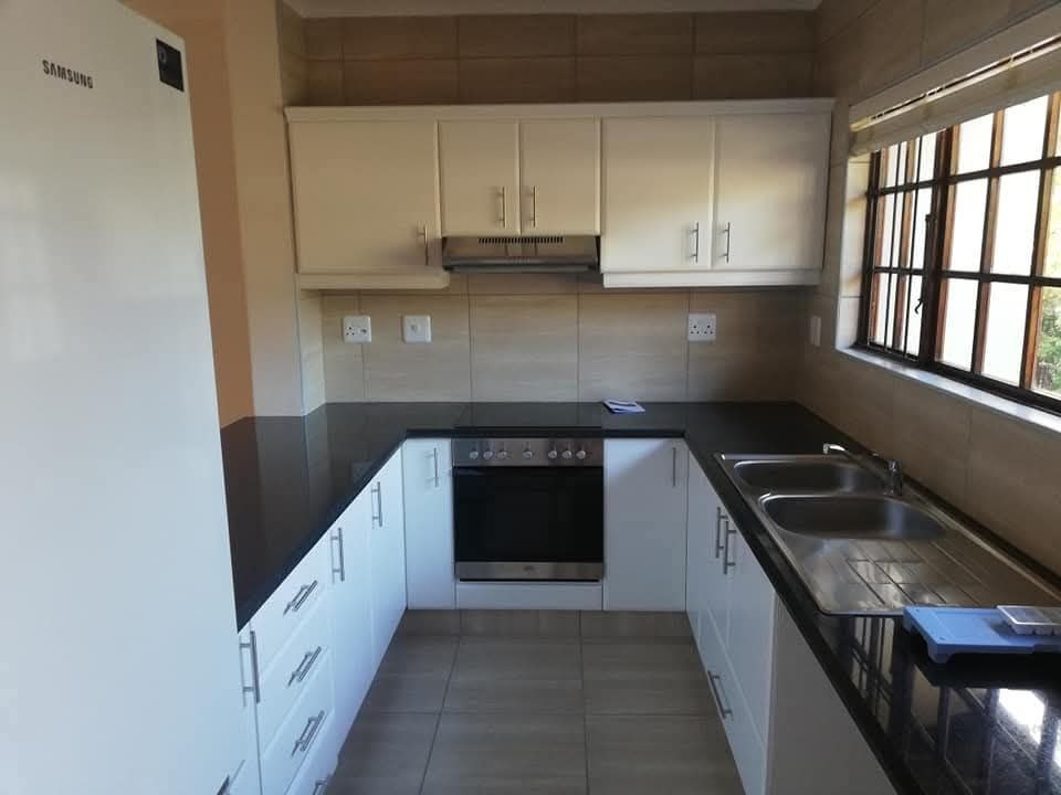 Finished white kitchen renovation with sink plumbing by ERS Plumbers